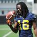 Michigan senior quarterback Denard Robinson smiles as he poses for a photo during media day at the Al Glick Field House on Sunday afternoon. Melanie Maxwell I AnnArbor.com